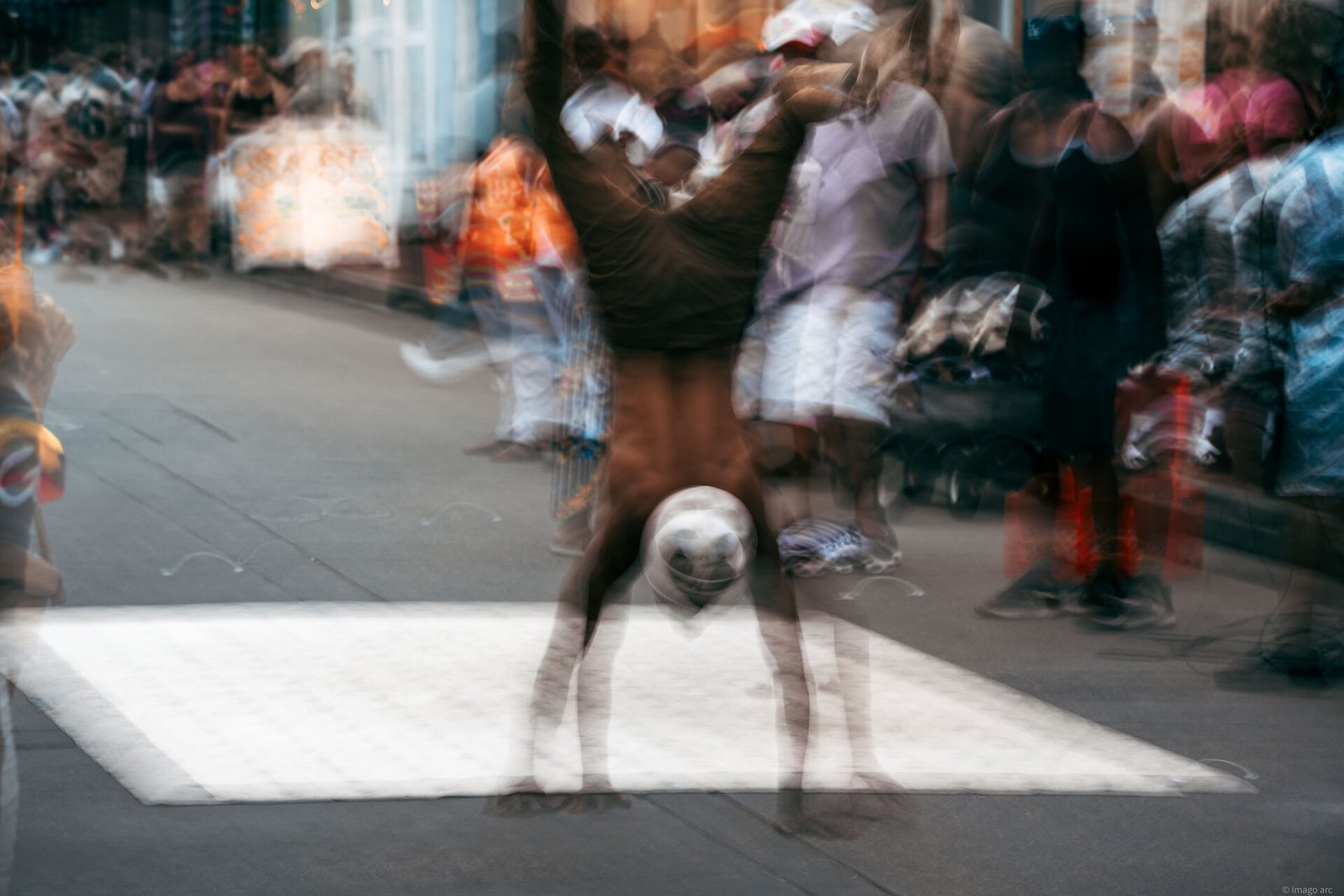 Breakdancer performing a street move, captured mid-motion in Buenos Aires