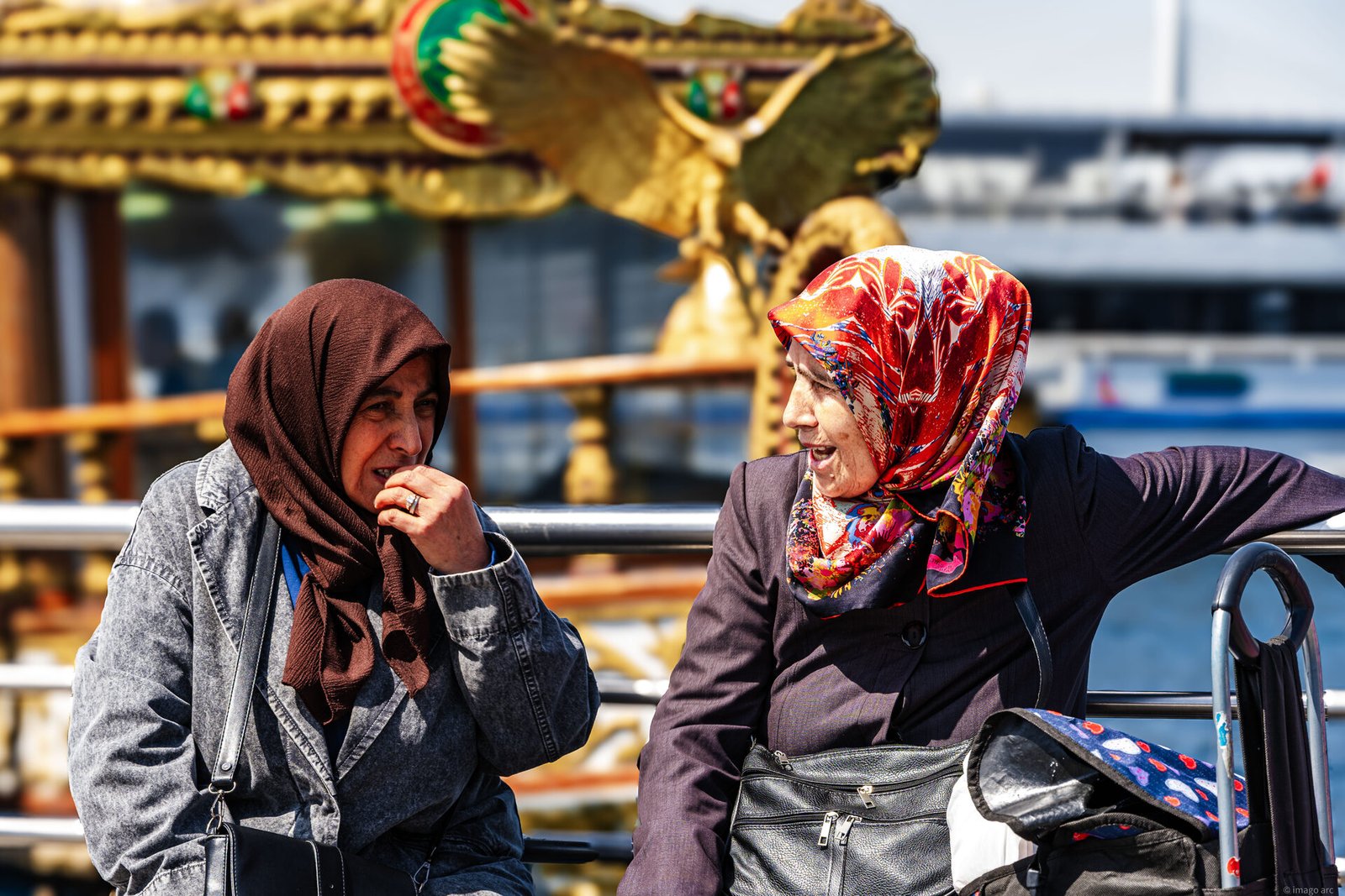 Women walking through a sunlit street in Istanbul, Turkey