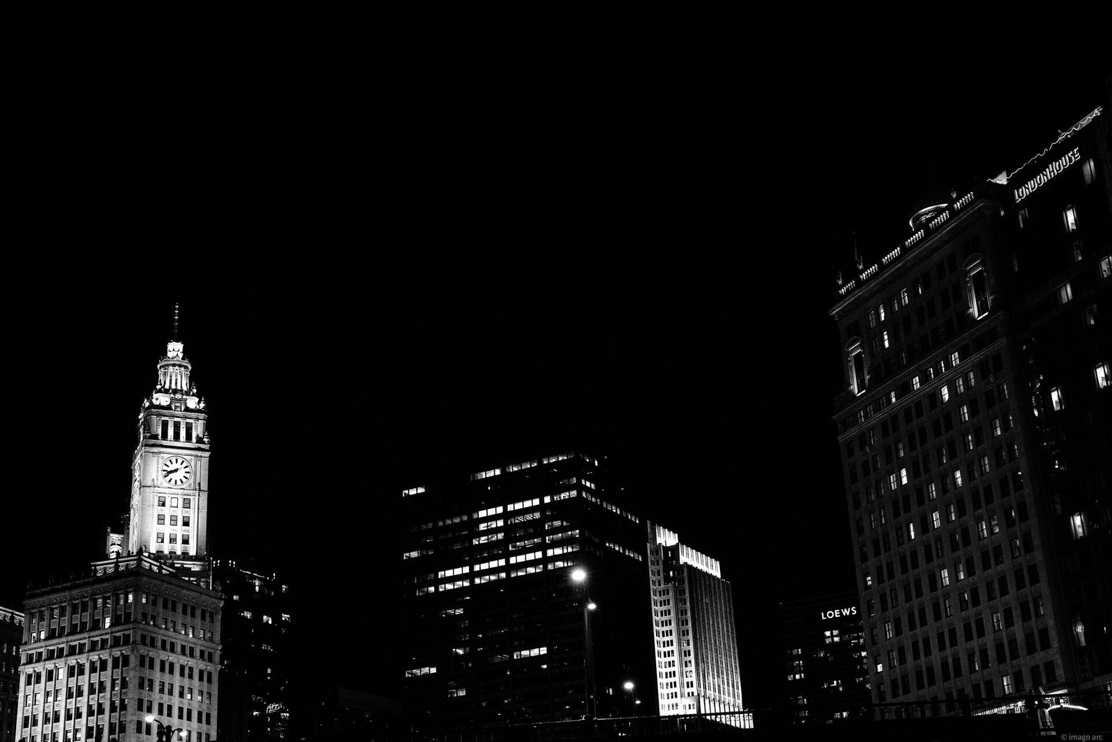 Chicago skyline and city lights reflected on the river at night, Illinois