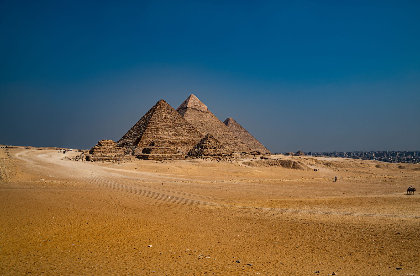 The Great Pyramids of Giza silhouetted against the sky, Cairo, Egypt